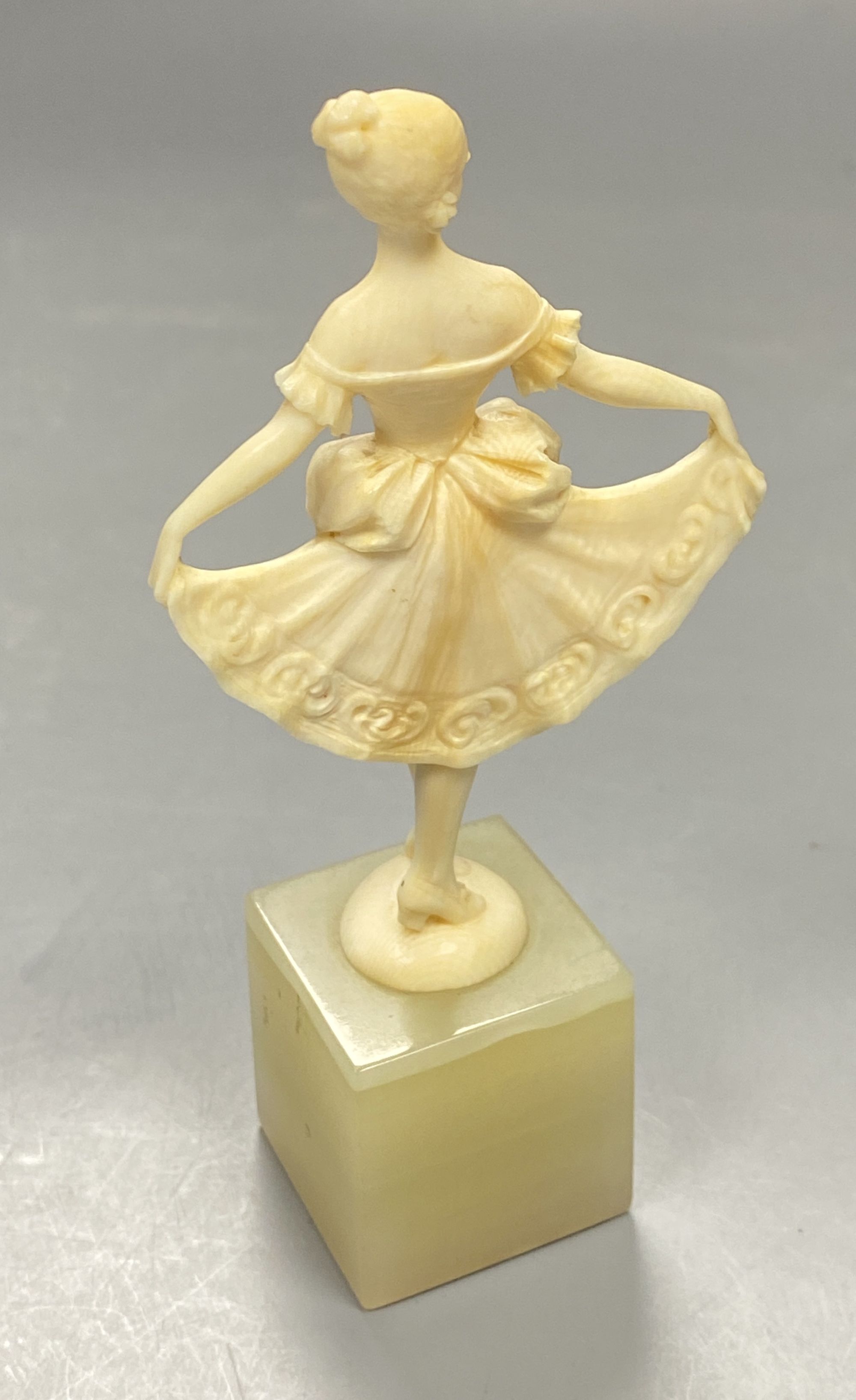 An Art Deco ivory figure of a dancer on an onyx base, height 12cm